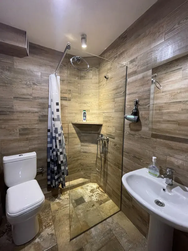 Clean bathroom with a walk-in shower